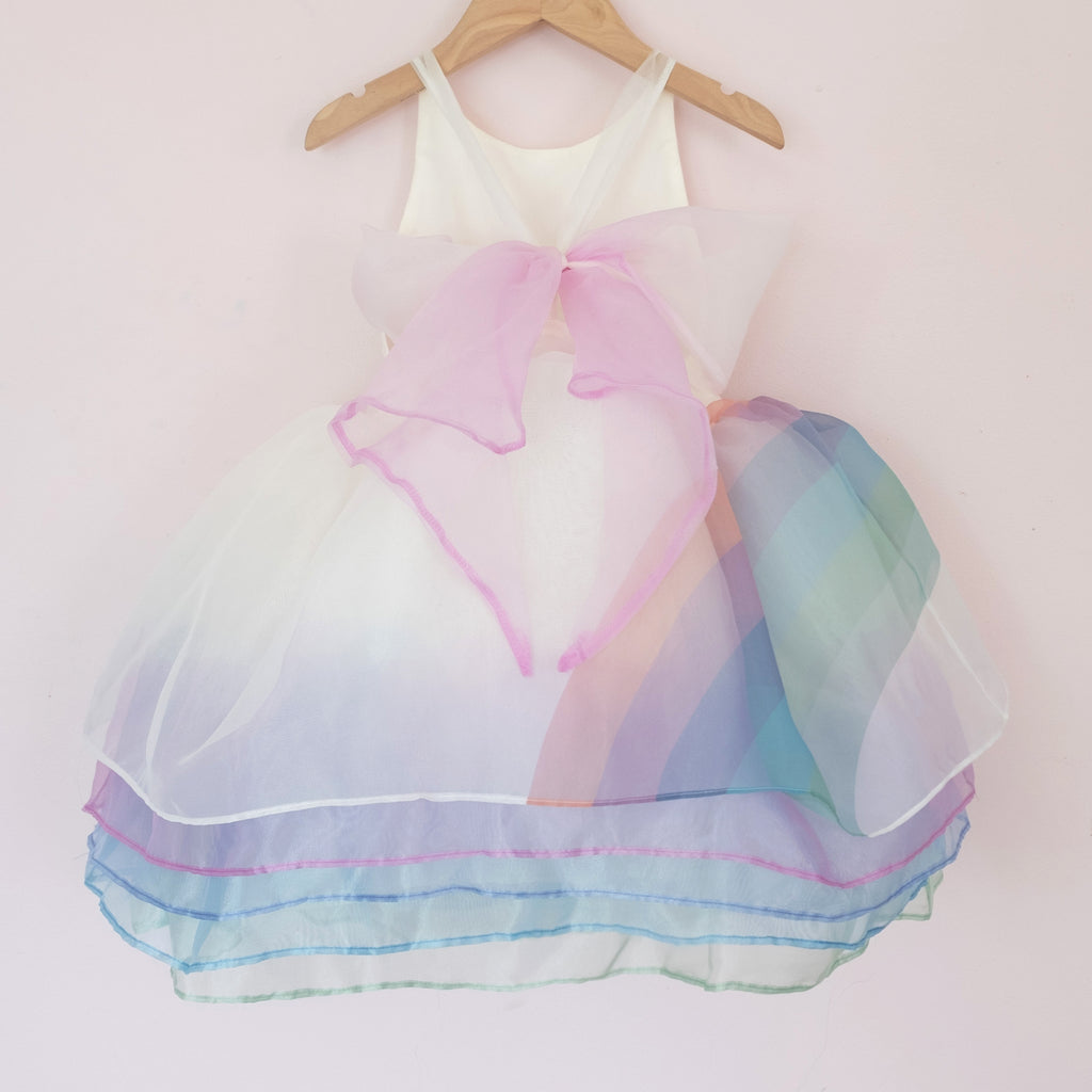 Back of a Pleiades Designs organza shortie dress with a side rainbow, 5 layers, and a dip dyed bow back