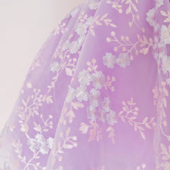 Close up of a Pleiades Designs purple tulle skirt with an embroidered floral layer