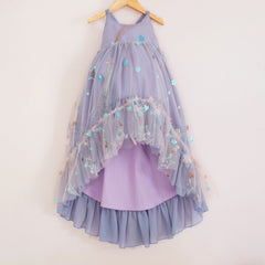 Front of a Pleiades Designs high low dress with embroidered stars, periwinkle chiffon, and a ruffle hem