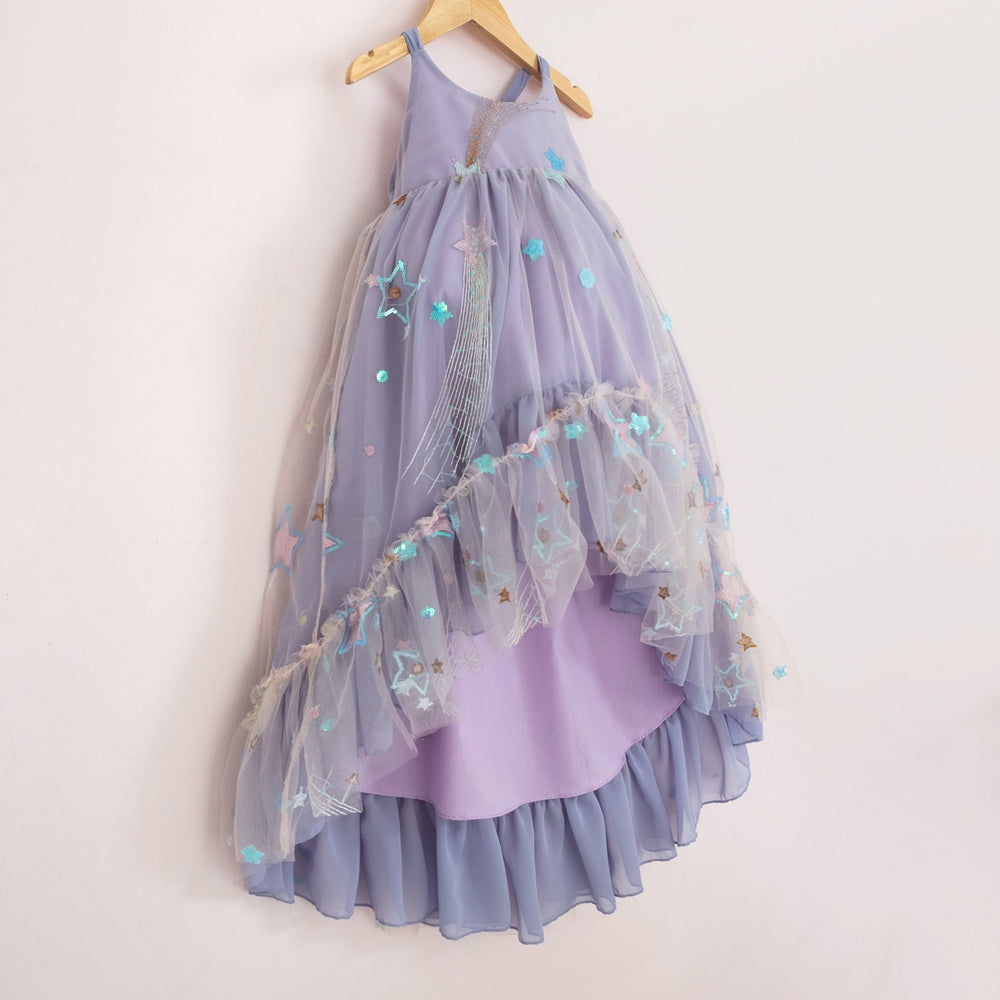 Front of a Pleiades Designs high low dress with embroidered stars, periwinkle chiffon, and a ruffle hem