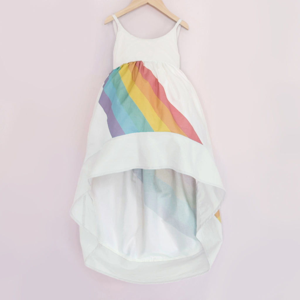 White high low dress with a bright rainbow across the front and back