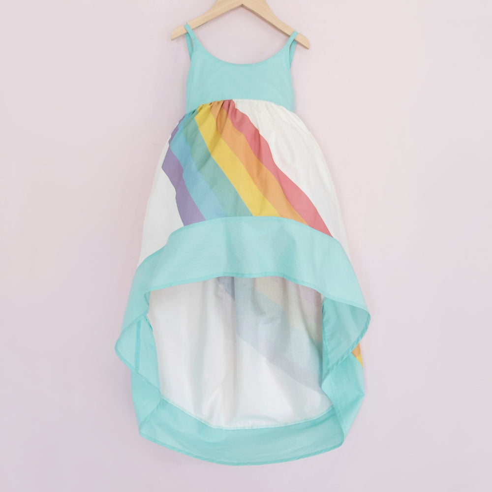 
                  
                    White and aqua high low dress with a bright rainbow across the front and back
                  
                