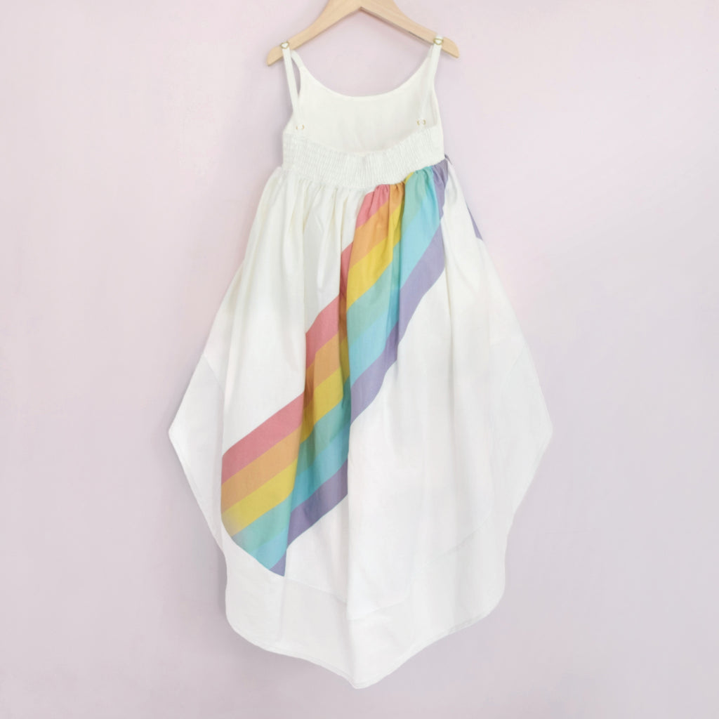 White high low dress with a bright rainbow across the back