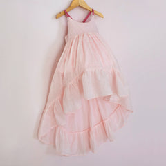 Front of a Pleiades Designs pink clip dot cotton high low dress with a ruffle hem