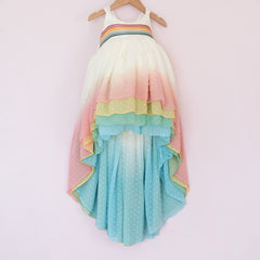 Front of a Pleiades Designs clip dot high low dress with a rainbow ombre skirt and a rainbow stripe bodice
