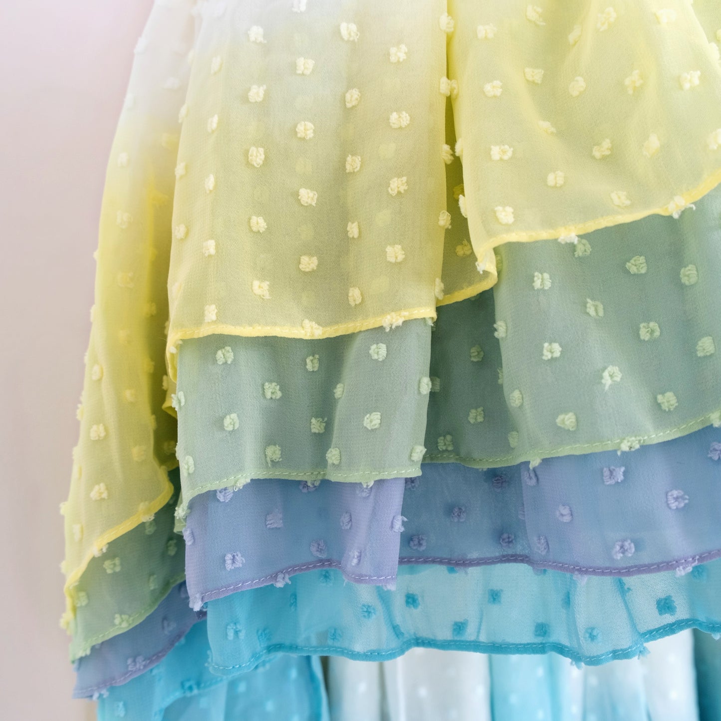 
                  
                    Close up of Pleiades Designs yellow to blue ombre clip dot chiffon layers
                  
                