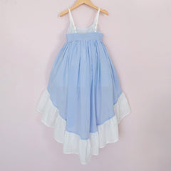 Back of a Pleiades Designs high low dress. Made with a blue and ivory clip dot cotton and a full ruffle hem