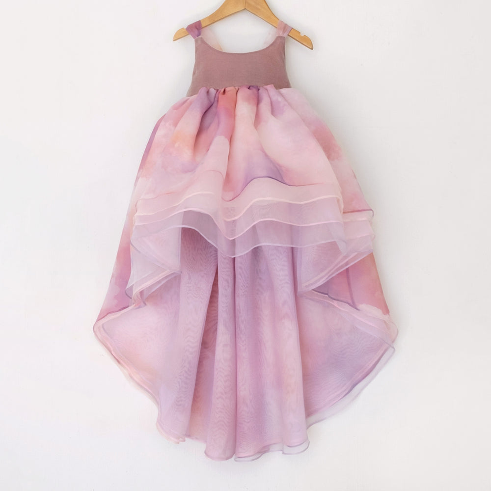 Front of a Pleiades Designs high low dress with a pink and purple cloud design